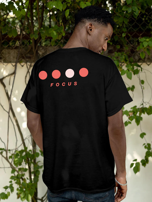 Model wearing Men's Black Round Neck T-shirt with 'Focus On Goal' design, offering effortless style and premium comfort