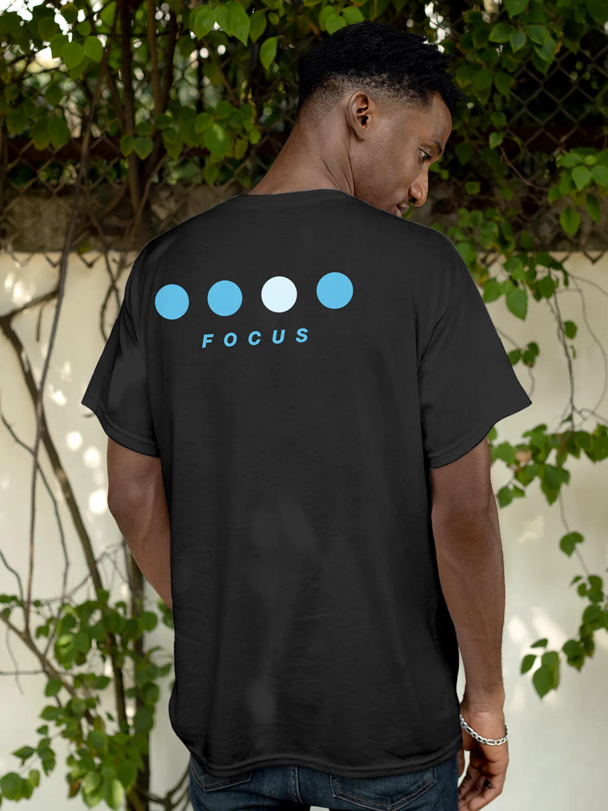 Model wearing Men's Dark Grey Round Neck T-shirt with 'Focus On Goal' design, offering effortless style and premium comfort