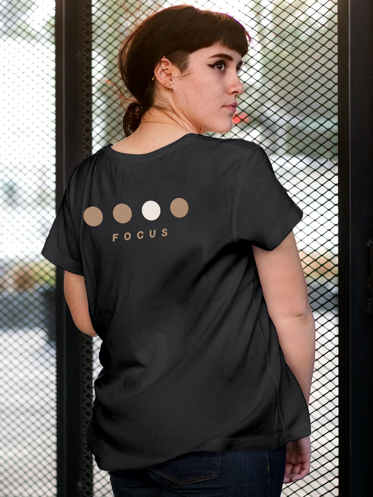 Model wearing Women's Dark Grey Round Neck T-shirt with 'Focus On Goal' design, offering effortless style and premium comfort