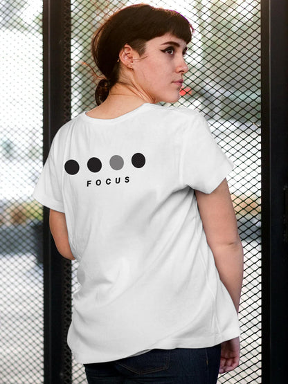 Model wearing Women's White Round Neck T-shirt with 'Focus On Goal' design, offering effortless style and premium comfort