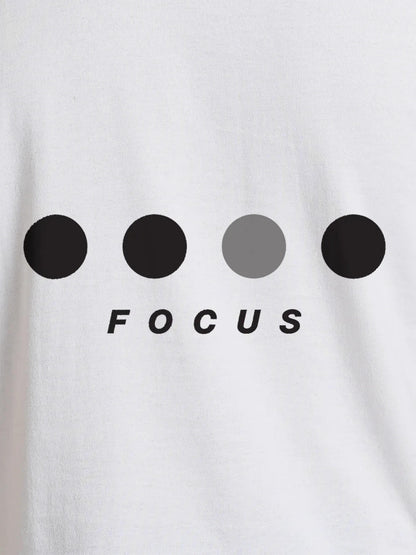Close up of 'Focus On Goal' design on Women's White Round Neck T-shirt, highlighting intricate details and vibrant print.