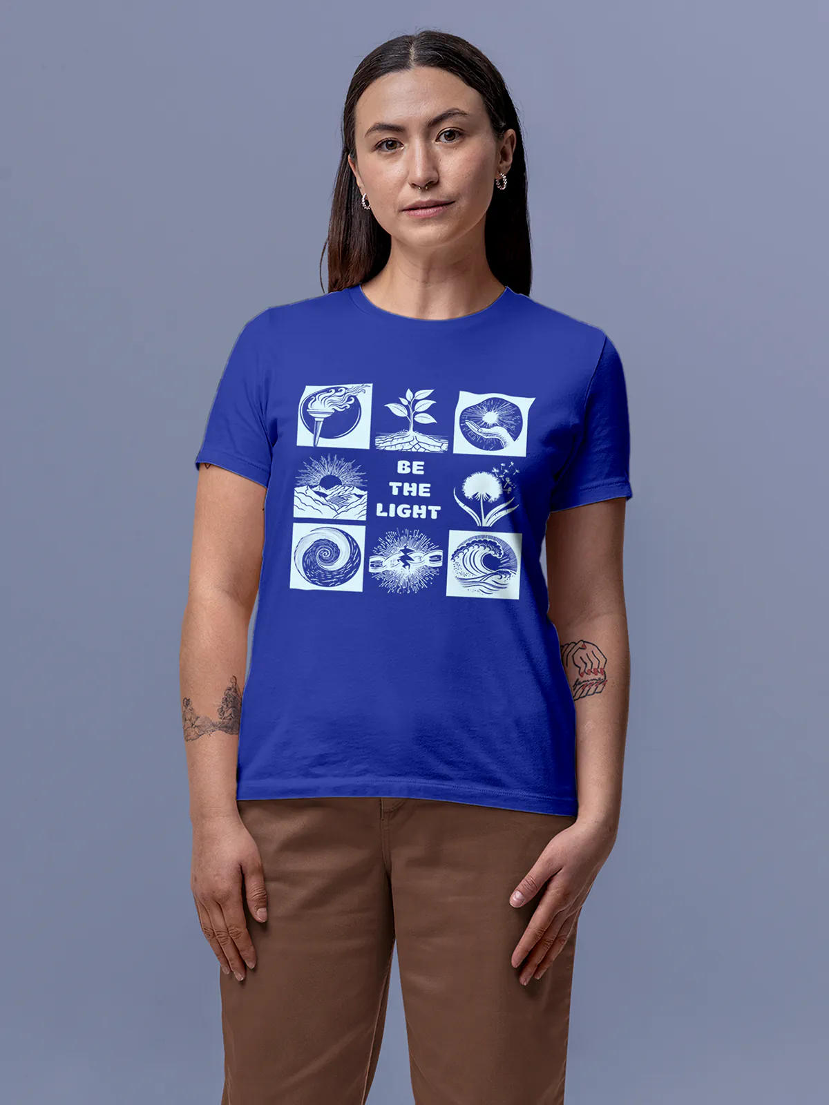 Model wearing Women's Blue Round Neck T-shirt with 'Be The Light' design, offering effortless style and premium comfort
