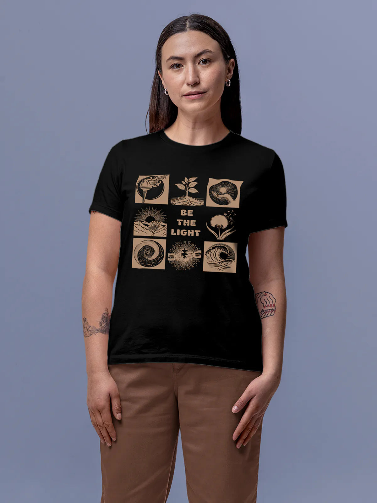 Model wearing Women's Black Round Neck T-shirt with 'Be The Light' design, offering effortless style and premium comfort
