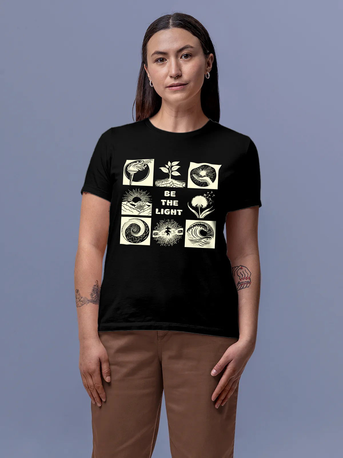 Model wearing Women's Black Round Neck T-shirt with 'Be The Light' design, offering effortless style and premium comfort