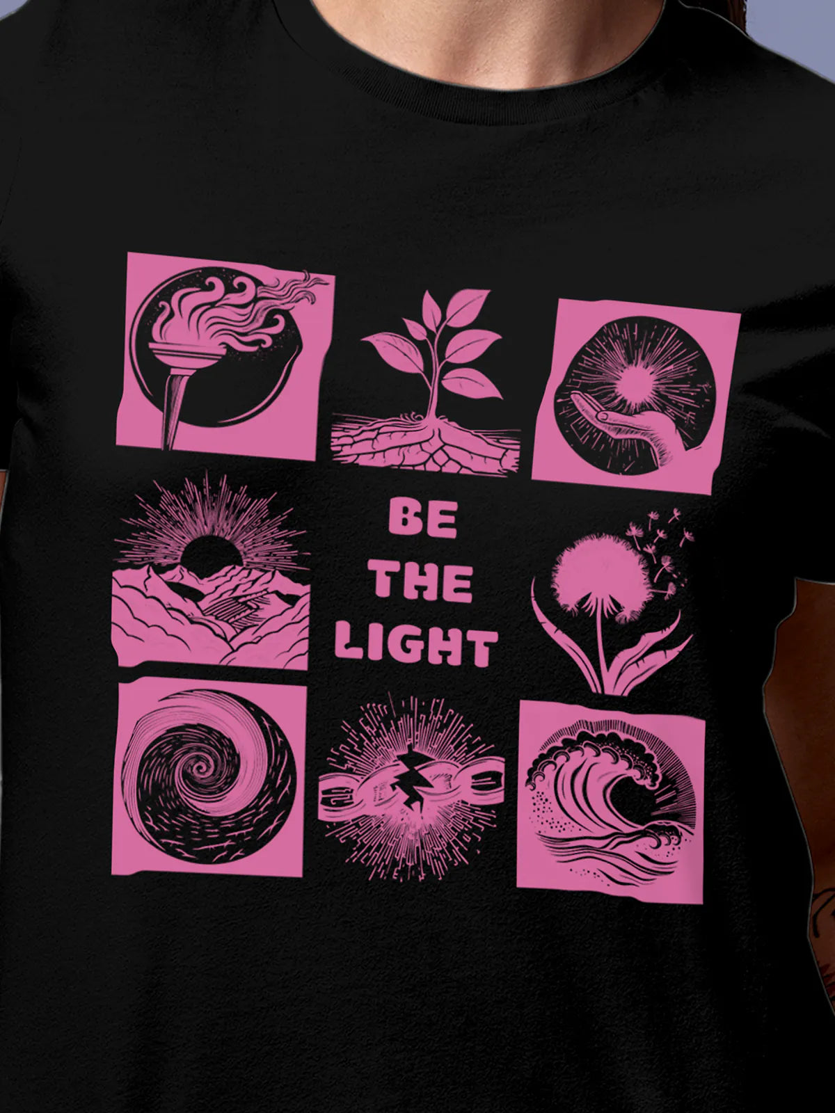 Close up of 'Be The Light' design on Women's Black Round Neck T-shirt, highlighting intricate details and vibrant print.