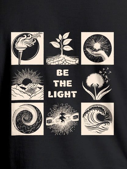 Close up of 'Be The Light' design on Men's Dark Grey Round Neck T-shirt, highlighting intricate details and vibrant print.