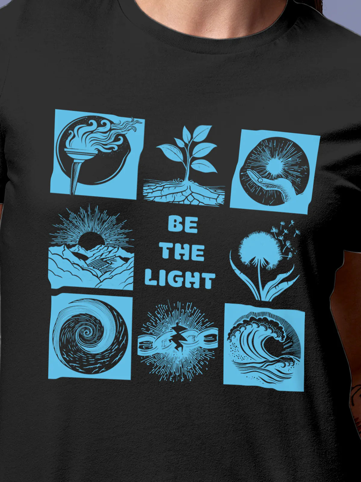 Close up of 'Be The Light' design on Women's Dark Grey Round Neck T-shirt, highlighting intricate details and vibrant print.