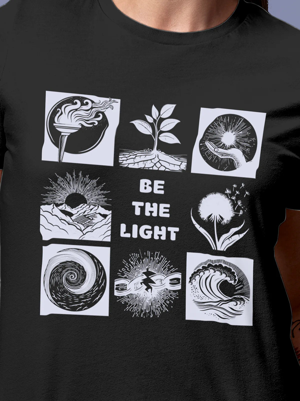 Close up of 'Be The Light' design on Women's Dark Grey Round Neck T-shirt, highlighting intricate details and vibrant print.