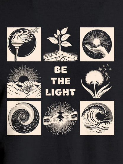 Close up of 'Be The Light' design on Women's Dark Grey Round Neck T-shirt, highlighting intricate details and vibrant print.