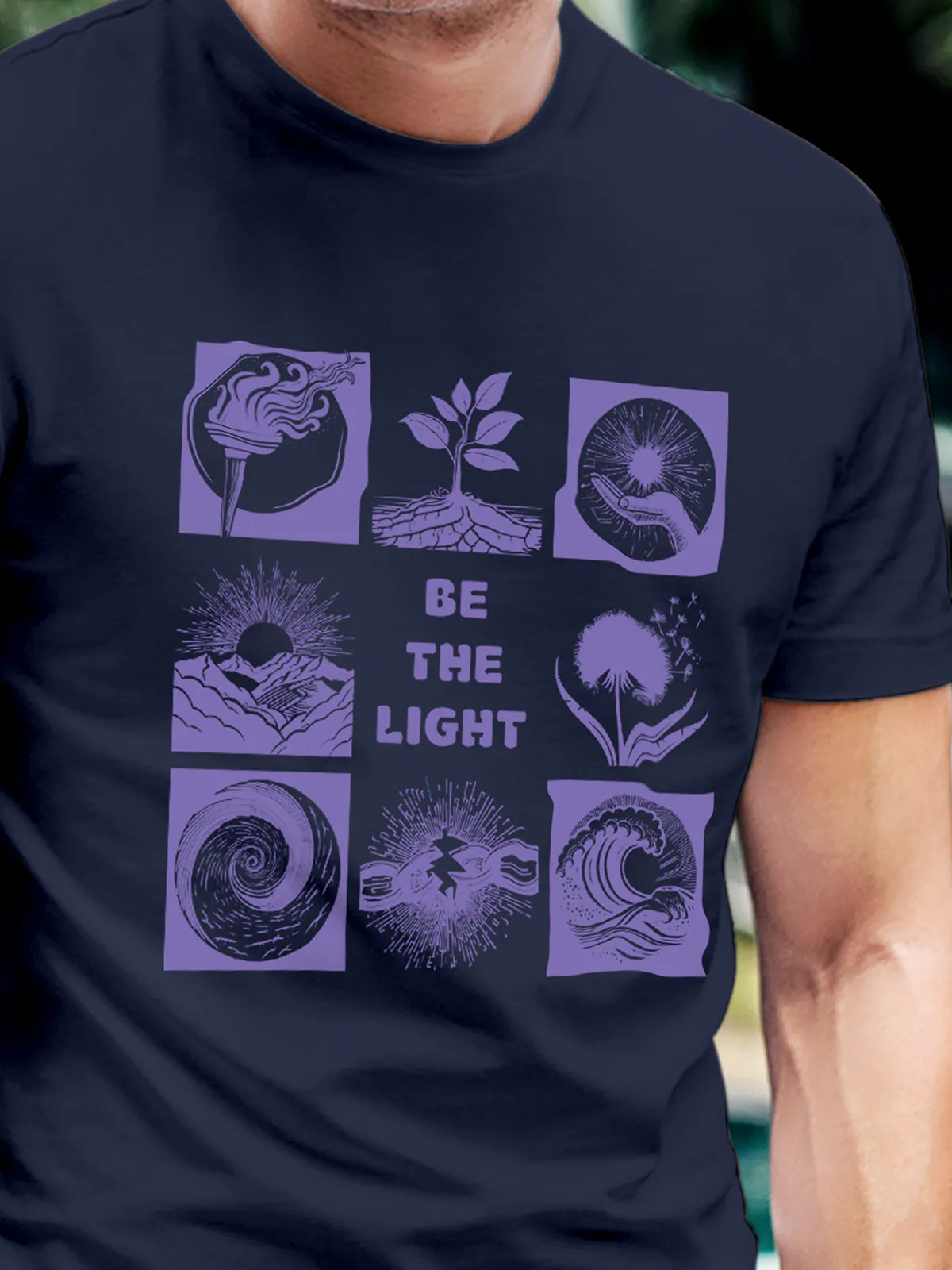 Close up of 'Be The Light' design on Men's Navy Blue Round Neck T-shirt, highlighting intricate details and vibrant print.