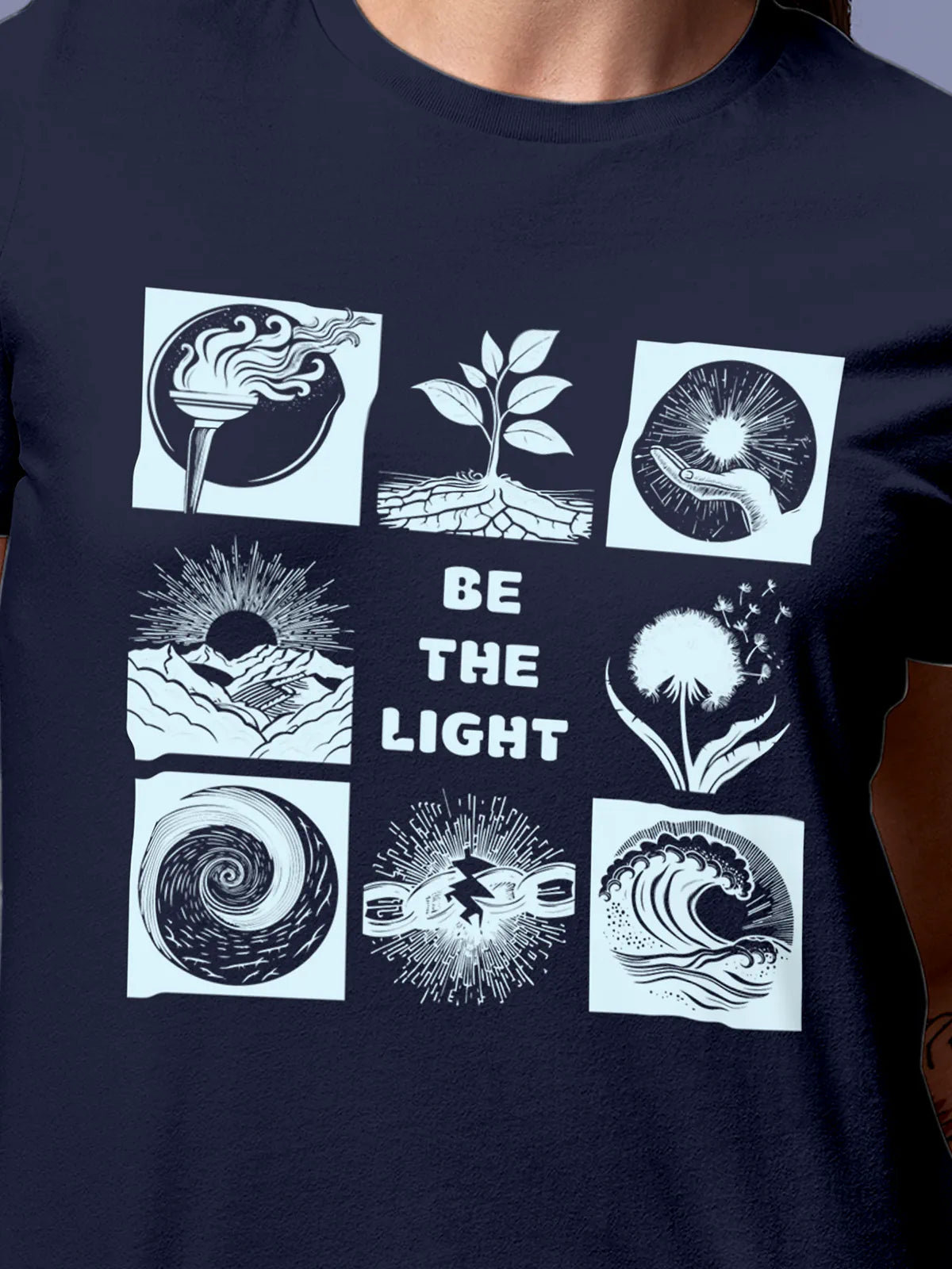 Close up of 'Be The Light' design on Women's Navy Blue Round Neck T-shirt, highlighting intricate details and vibrant print.