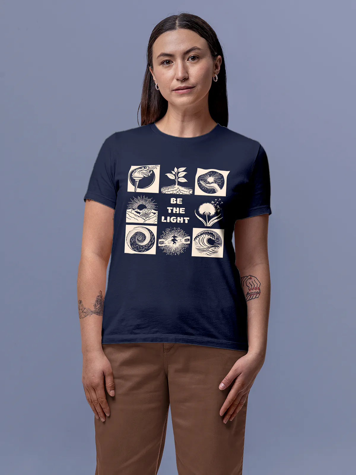 Model wearing Women's Navy Blue Round Neck T-shirt with 'Be The Light' design, offering effortless style and premium comfort