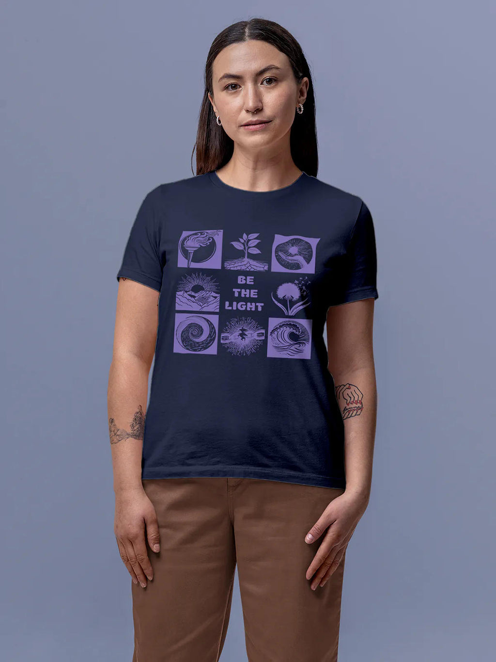 Model wearing Women's Navy Blue Round Neck T-shirt with 'Be The Light' design, offering effortless style and premium comfort