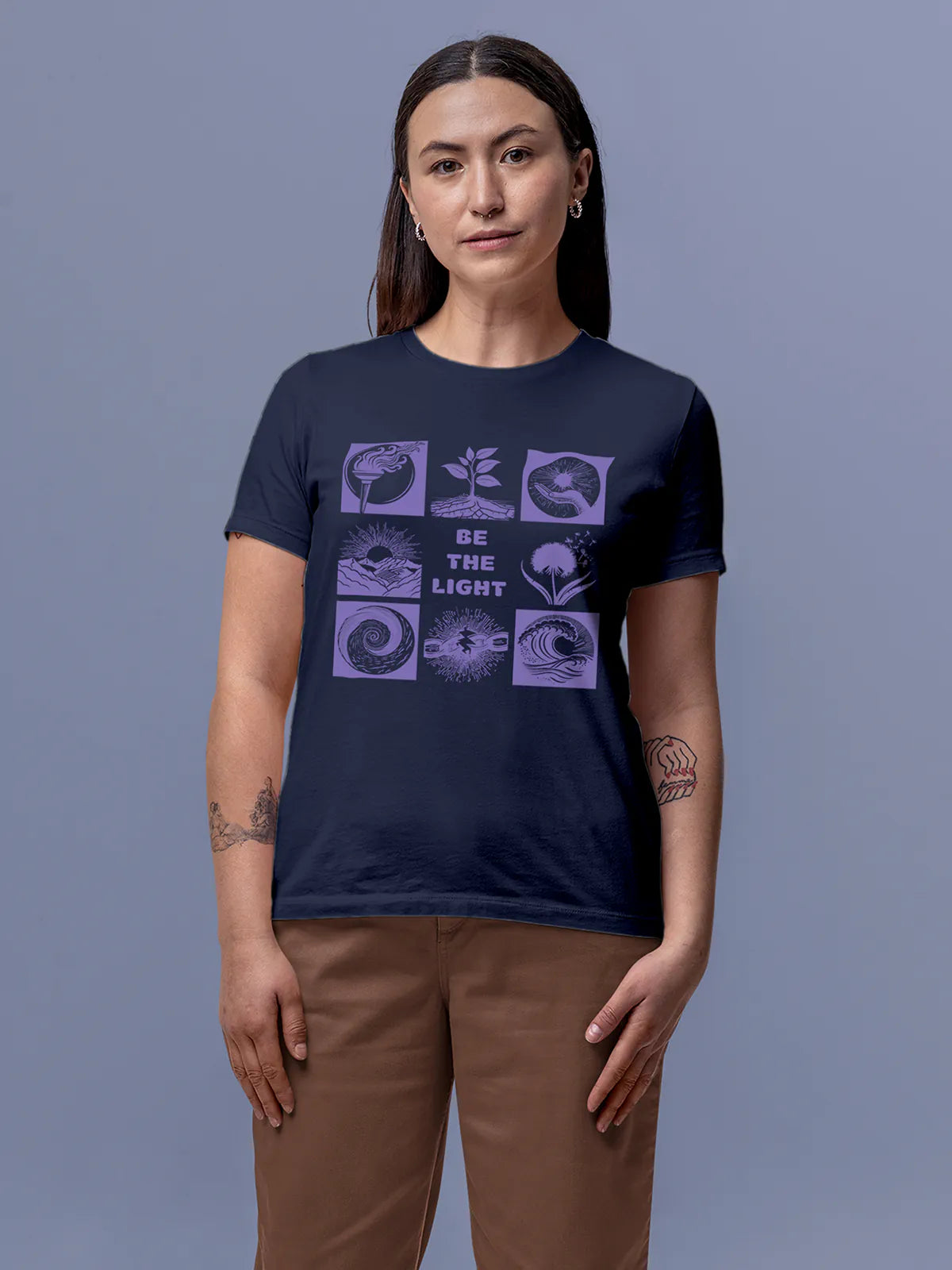 Model wearing Women's Navy Blue Round Neck T-shirt with 'Be The Light' design, offering effortless style and premium comfort