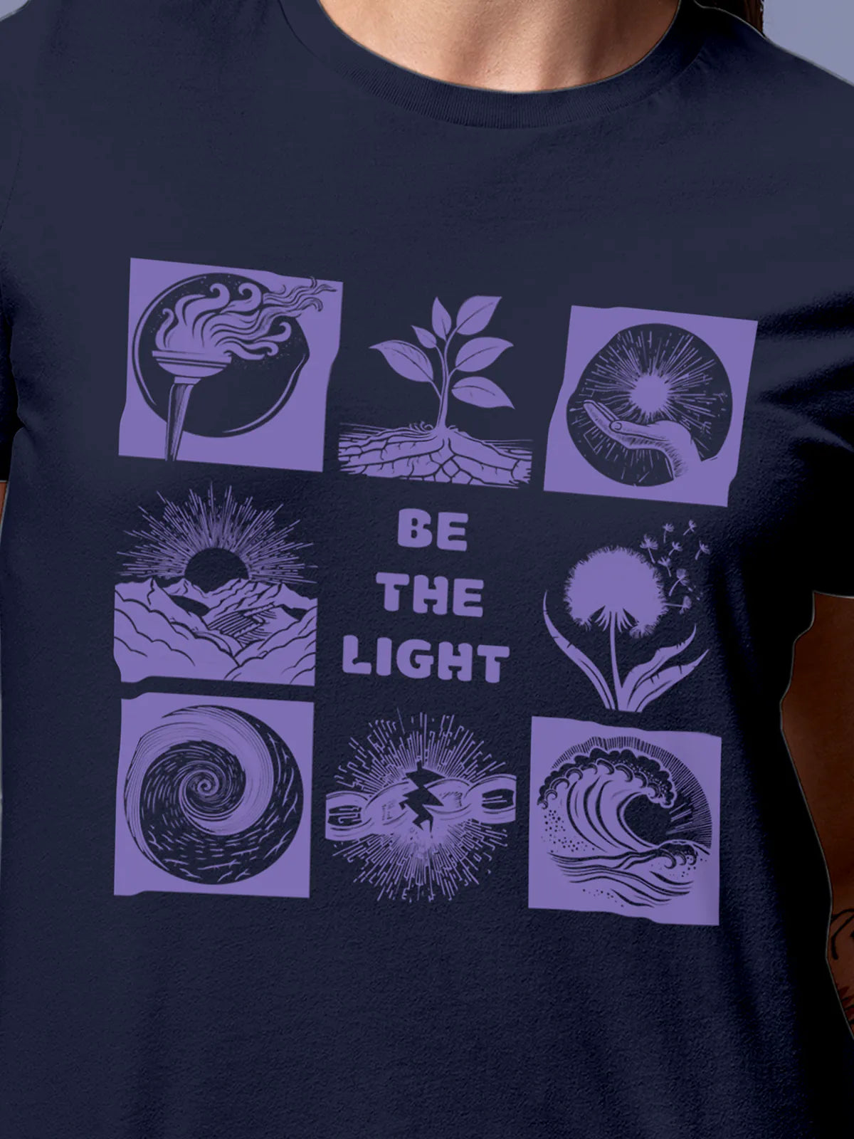 Close up of 'Be The Light' design on Women's Navy Blue Round Neck T-shirt, highlighting intricate details and vibrant print.