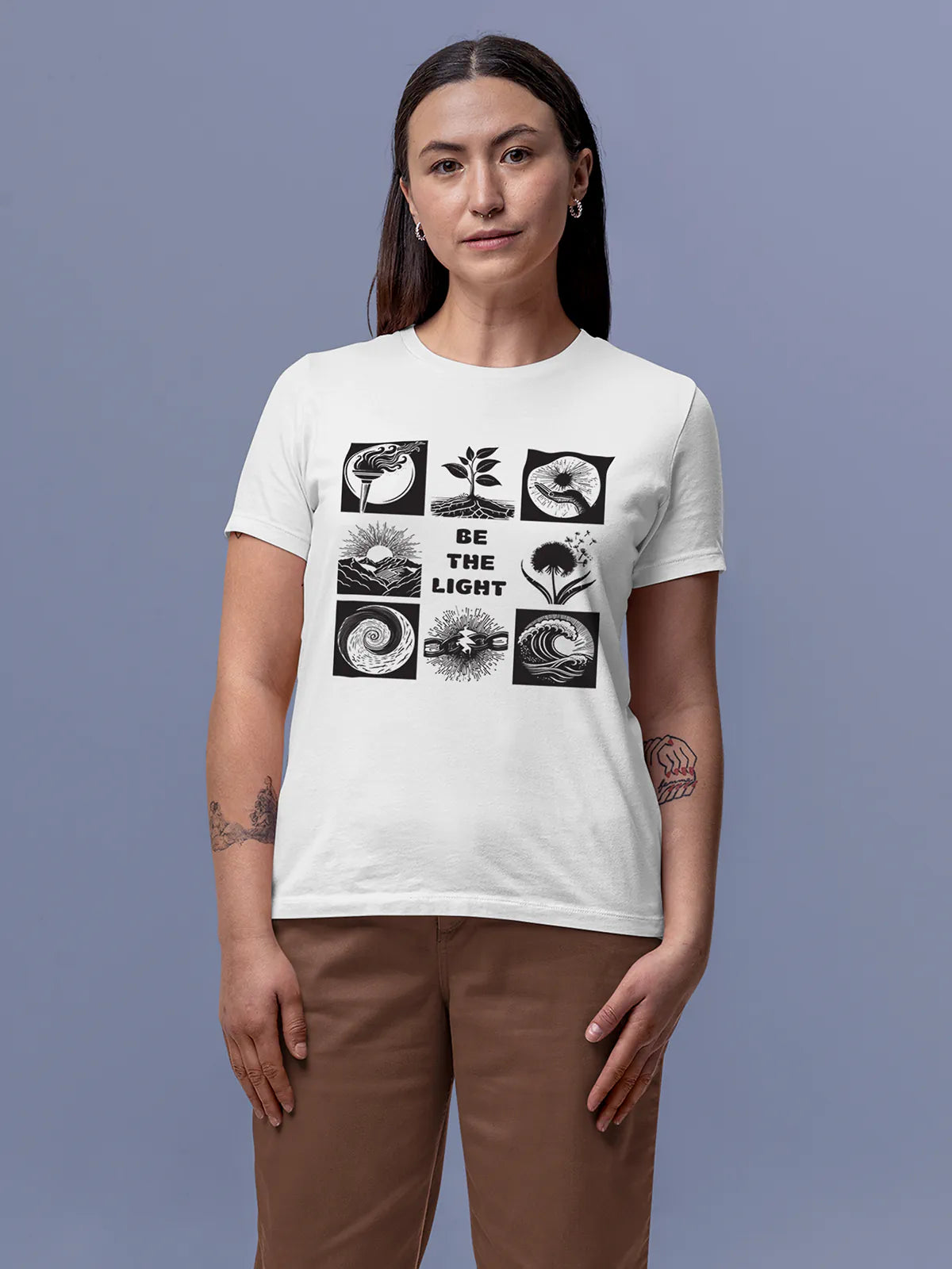 Model wearing Women's White Round Neck T-shirt with 'Be The Light' design, offering effortless style and premium comfort