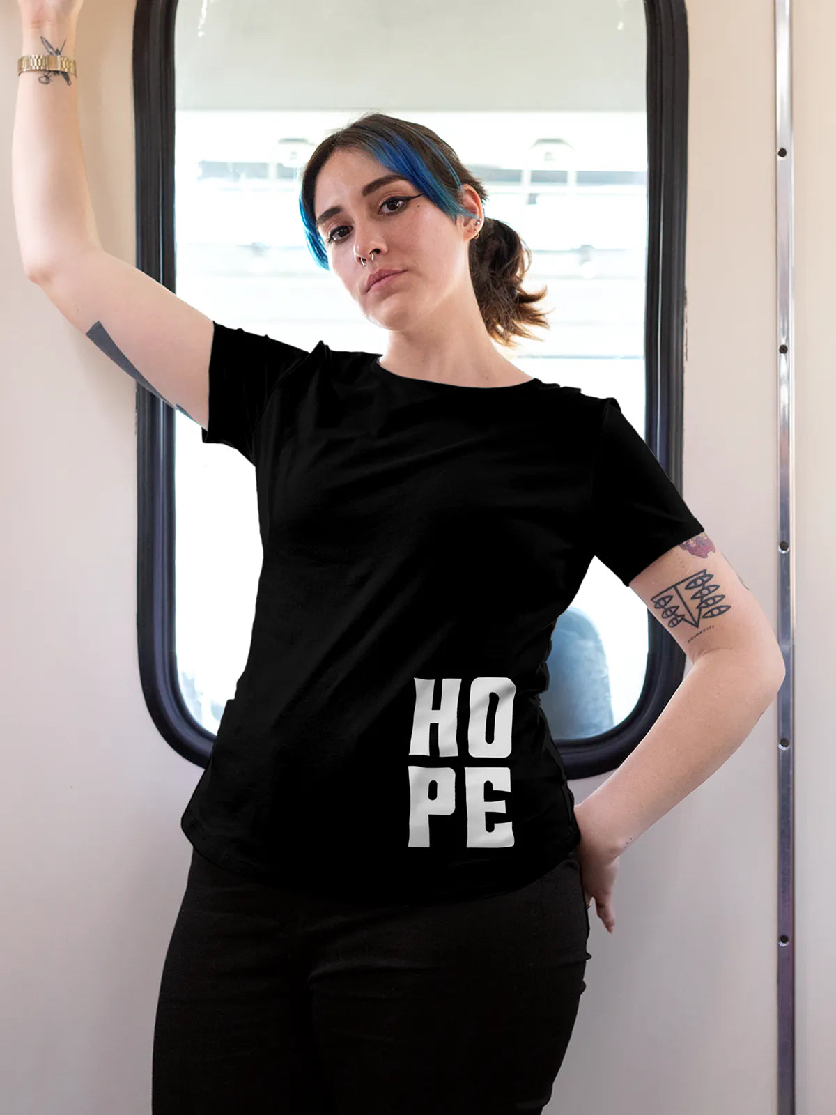 Model wearing Women's Black Round Neck T-shirt with 'Hope' design, offering effortless style and premium comfort