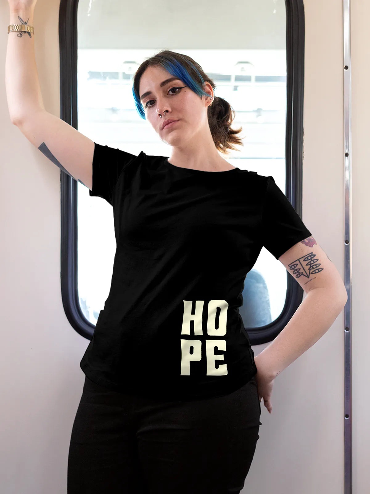 Model wearing Women's Black Round Neck T-shirt with 'Hope' design, offering effortless style and premium comfort