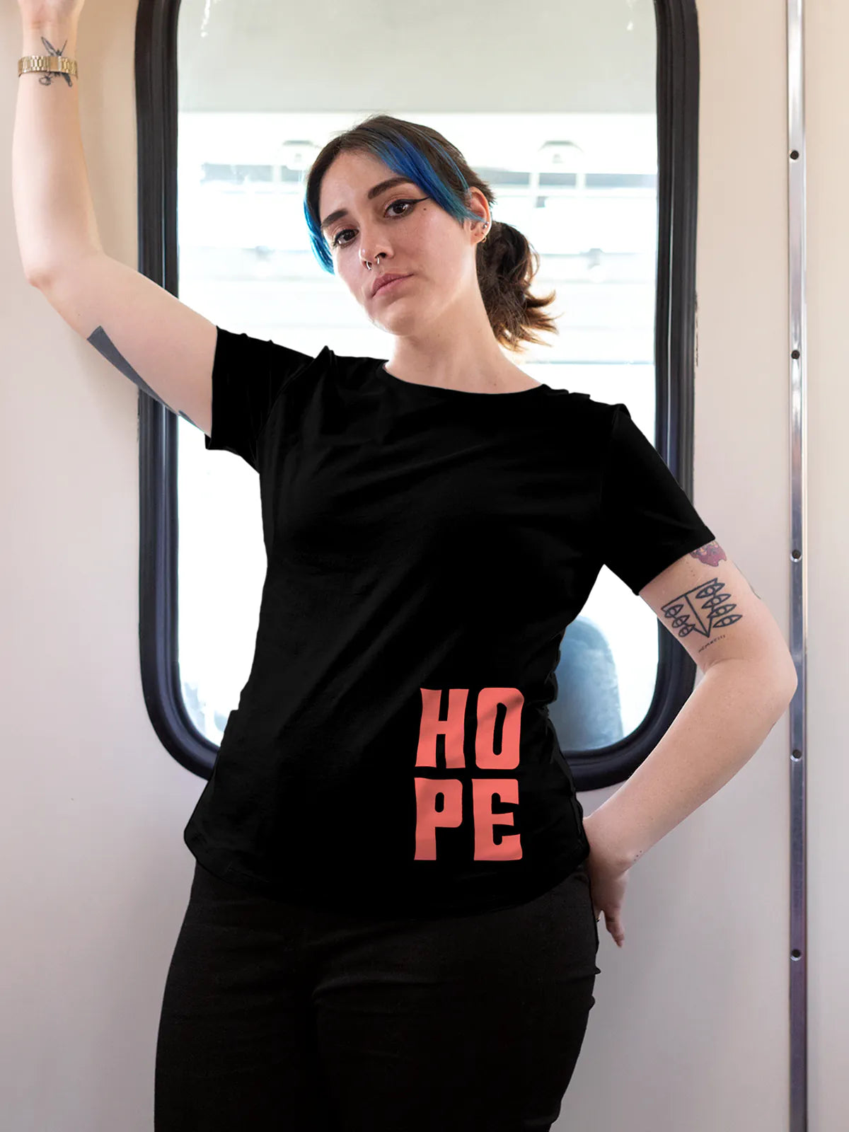 Model wearing Women's Black Round Neck T-shirt with 'Hope' design, offering effortless style and premium comfort