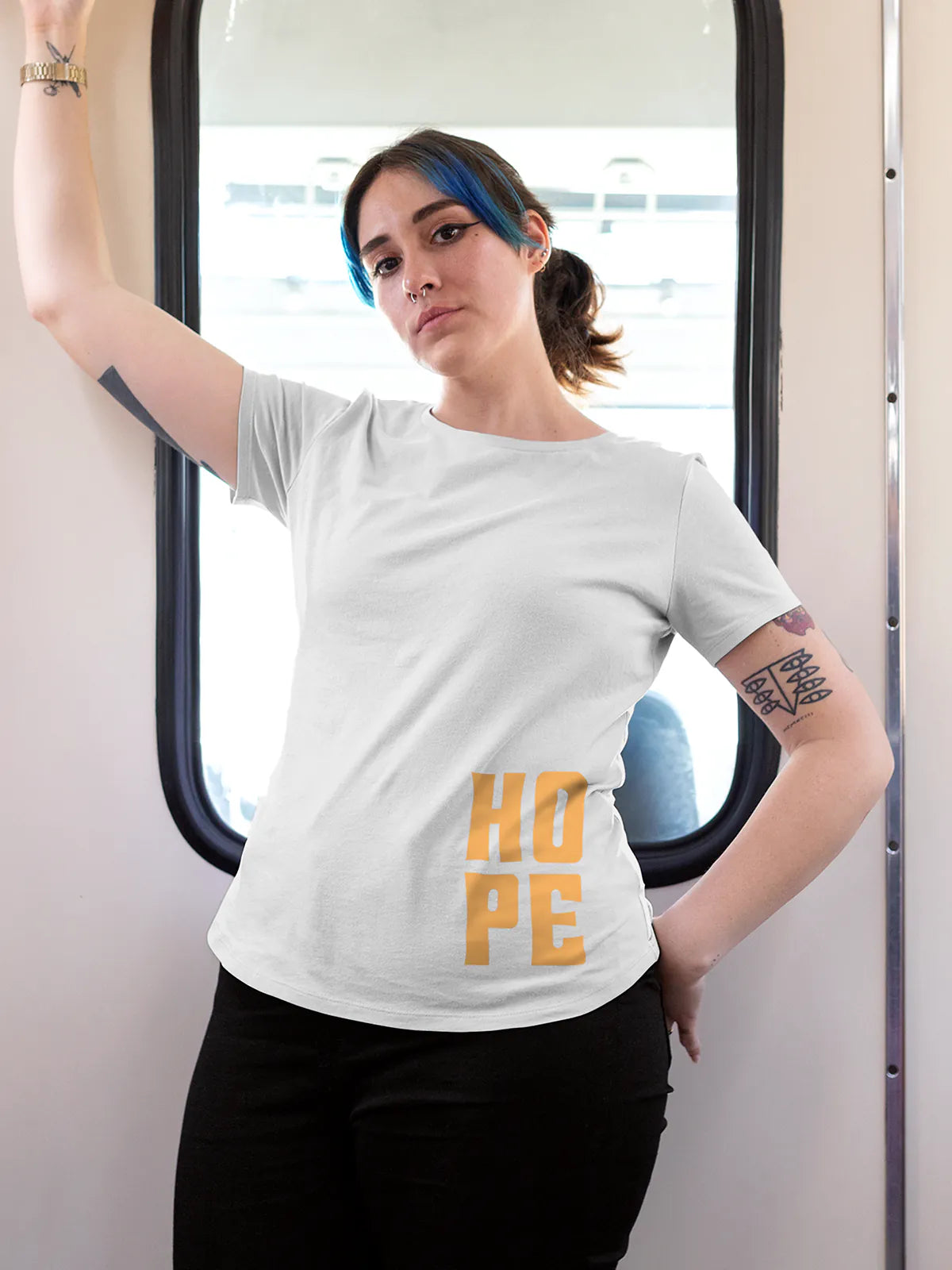 Model wearing Women's White Round Neck T-shirt with 'Hope' design, offering effortless style and premium comfort