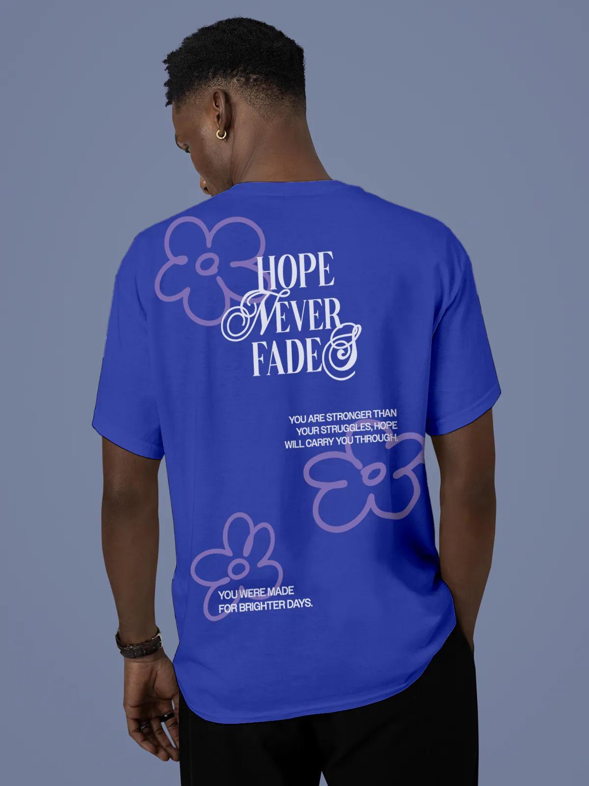 Model wearing Men's Blue Round Neck T-shirt with 'Hope Never Fades' design, offering effortless style and premium comfort
