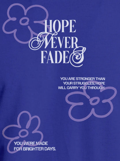 Close up of 'Hope Never Fades' design on Women's Blue Round Neck T-shirt, highlighting intricate details and vibrant print.