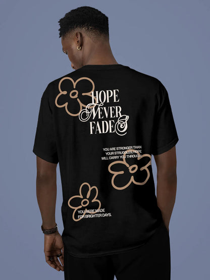 Model wearing Men's Black Round Neck T-shirt with 'Hope Never Fades' design, offering effortless style and premium comfort