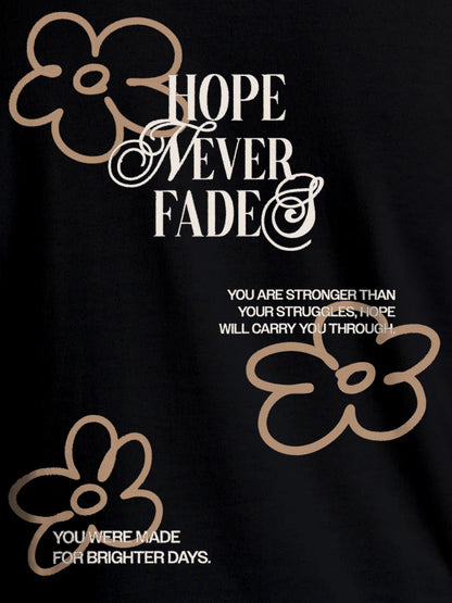 Close up of 'Hope Never Fades' design on Men's Black Round Neck T-shirt, highlighting intricate details and vibrant print.