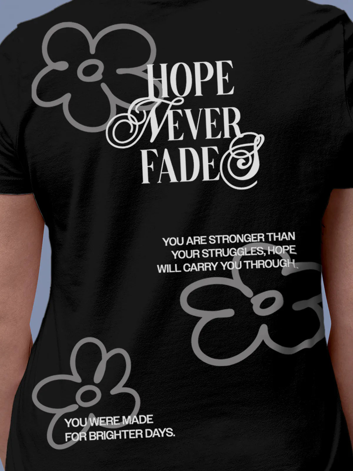 Close up of 'Hope Never Fades' design on Women's Black Round Neck T-shirt, highlighting intricate details and vibrant print.