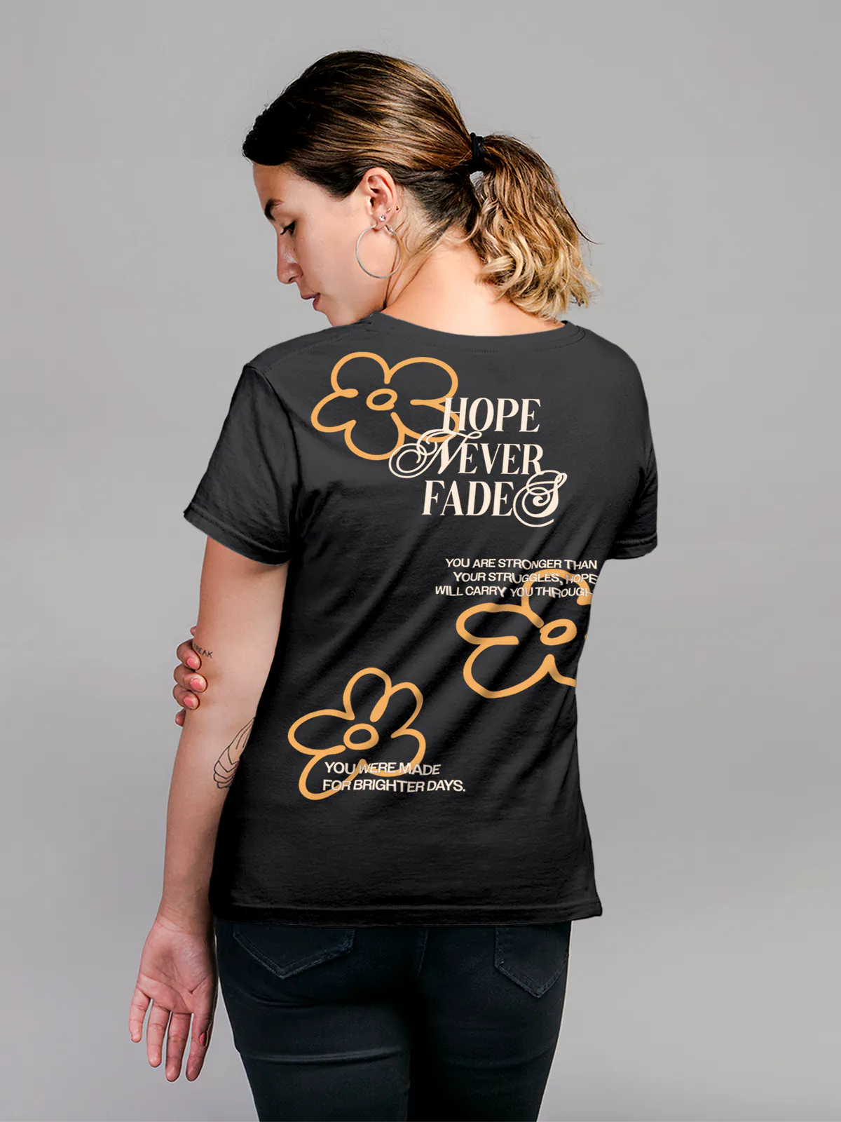 Model wearing Women's Dark Grey Round Neck T-shirt with 'Hope Never Fades' design, offering effortless style and premium comfort