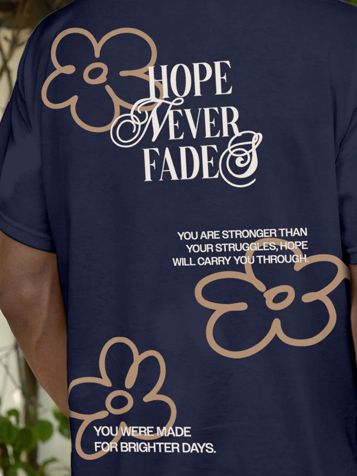 Close up of 'Hope Never Fades' design on Men's Navy Blue Round Neck T-shirt, highlighting intricate details and vibrant print.