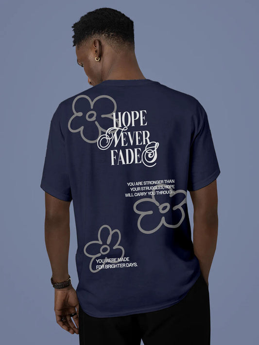 Model wearing Men's Navy Blue Round Neck T-shirt with 'Hope Never Fades' design, offering effortless style and premium comfort