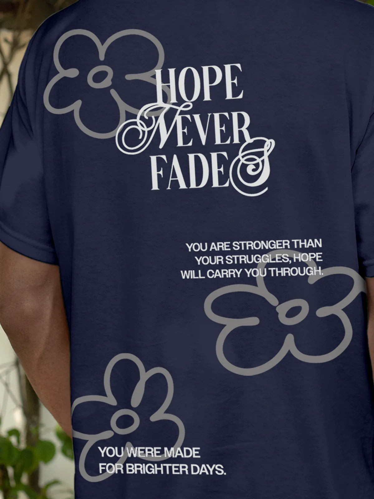 Close up of 'Hope Never Fades' design on Men's Navy Blue Round Neck T-shirt, highlighting intricate details and vibrant print.