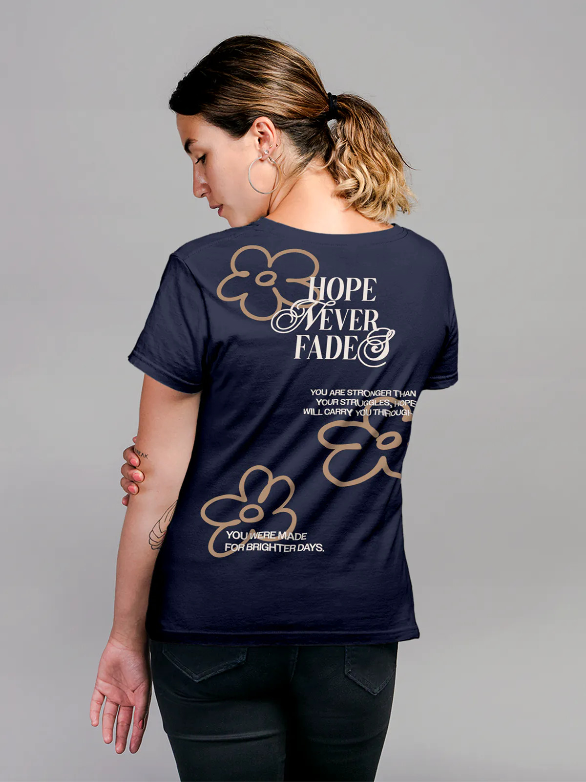 Model wearing Women's Navy Blue Round Neck T-shirt with 'Hope Never Fades' design, offering effortless style and premium comfort