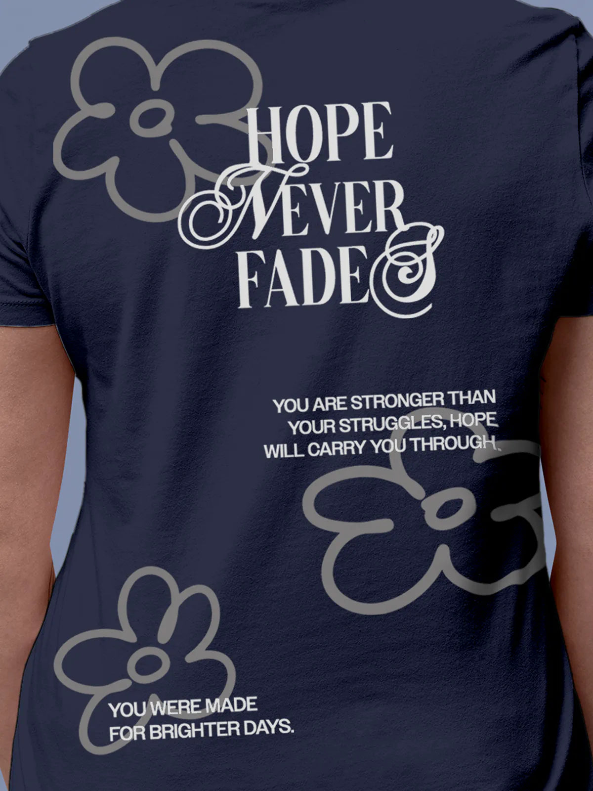 Close up of 'Hope Never Fades' design on Women's Navy Blue Round Neck T-shirt, highlighting intricate details and vibrant print.