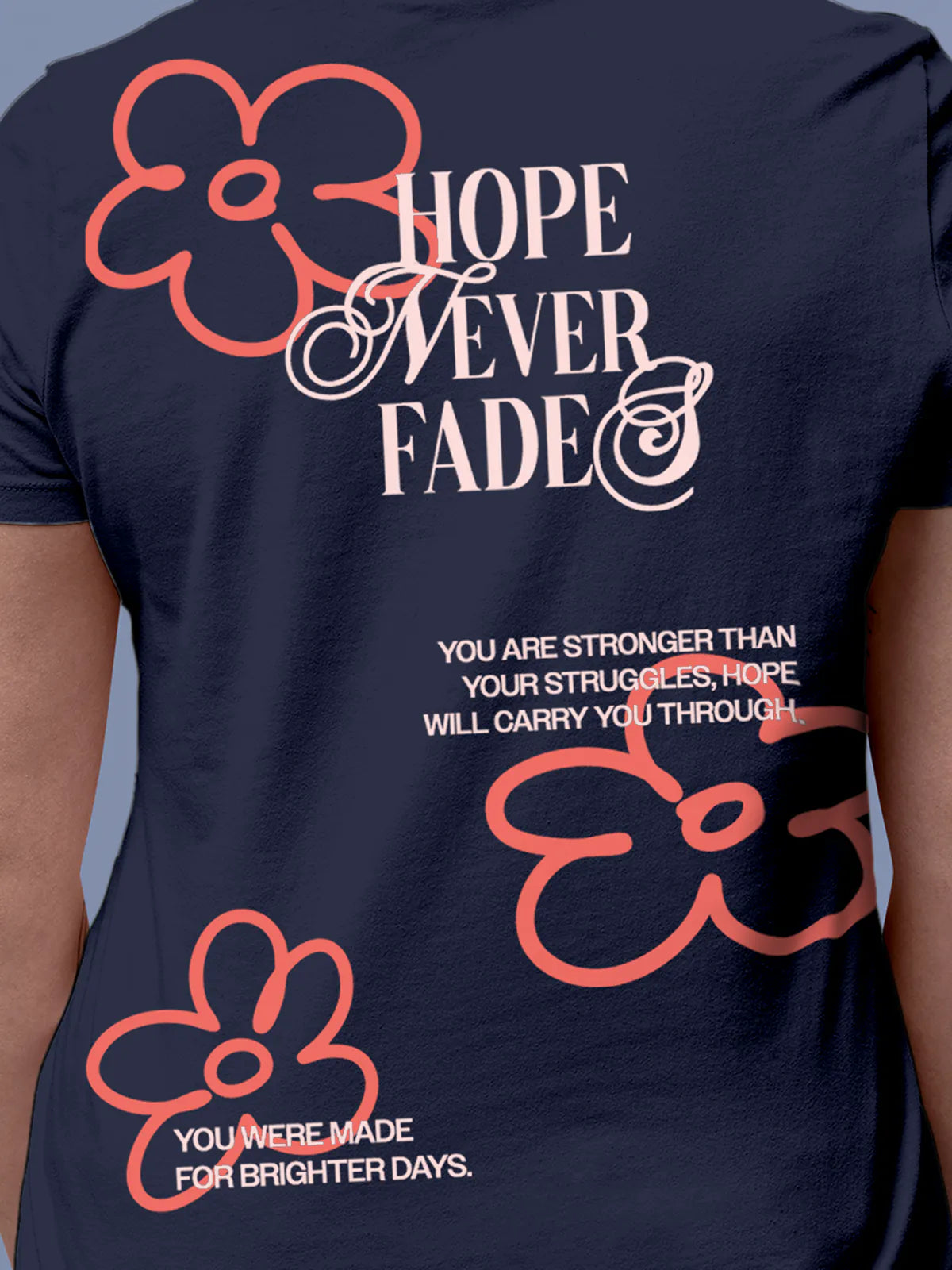 Close up of 'Hope Never Fades' design on Women's Navy Blue Round Neck T-shirt, highlighting intricate details and vibrant print.