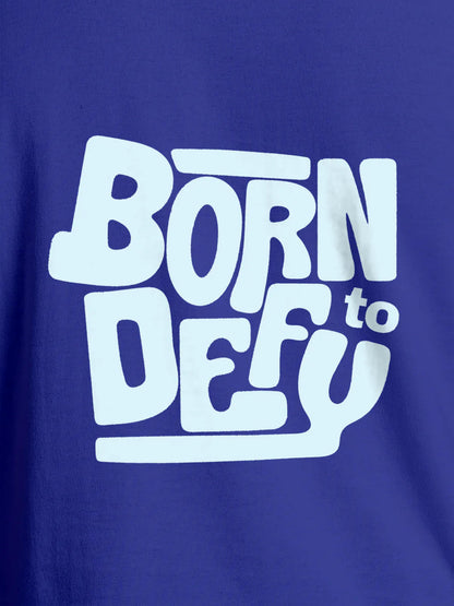 Close up of 'Born To Defy' design on Women's Blue Round Neck T-shirt, highlighting intricate details and vibrant print.
