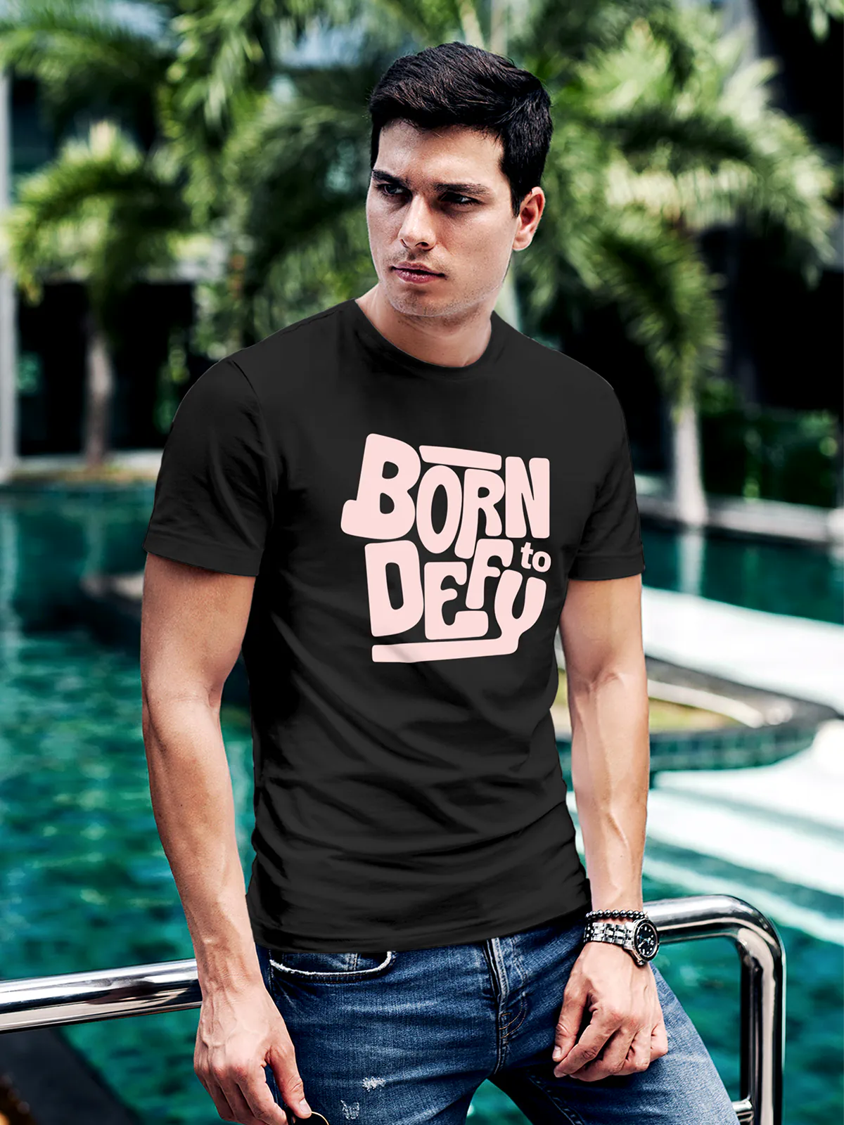 Model wearing Men's Dark Grey Round Neck T-shirt with 'Born To Defy' design, offering effortless style and premium comfort