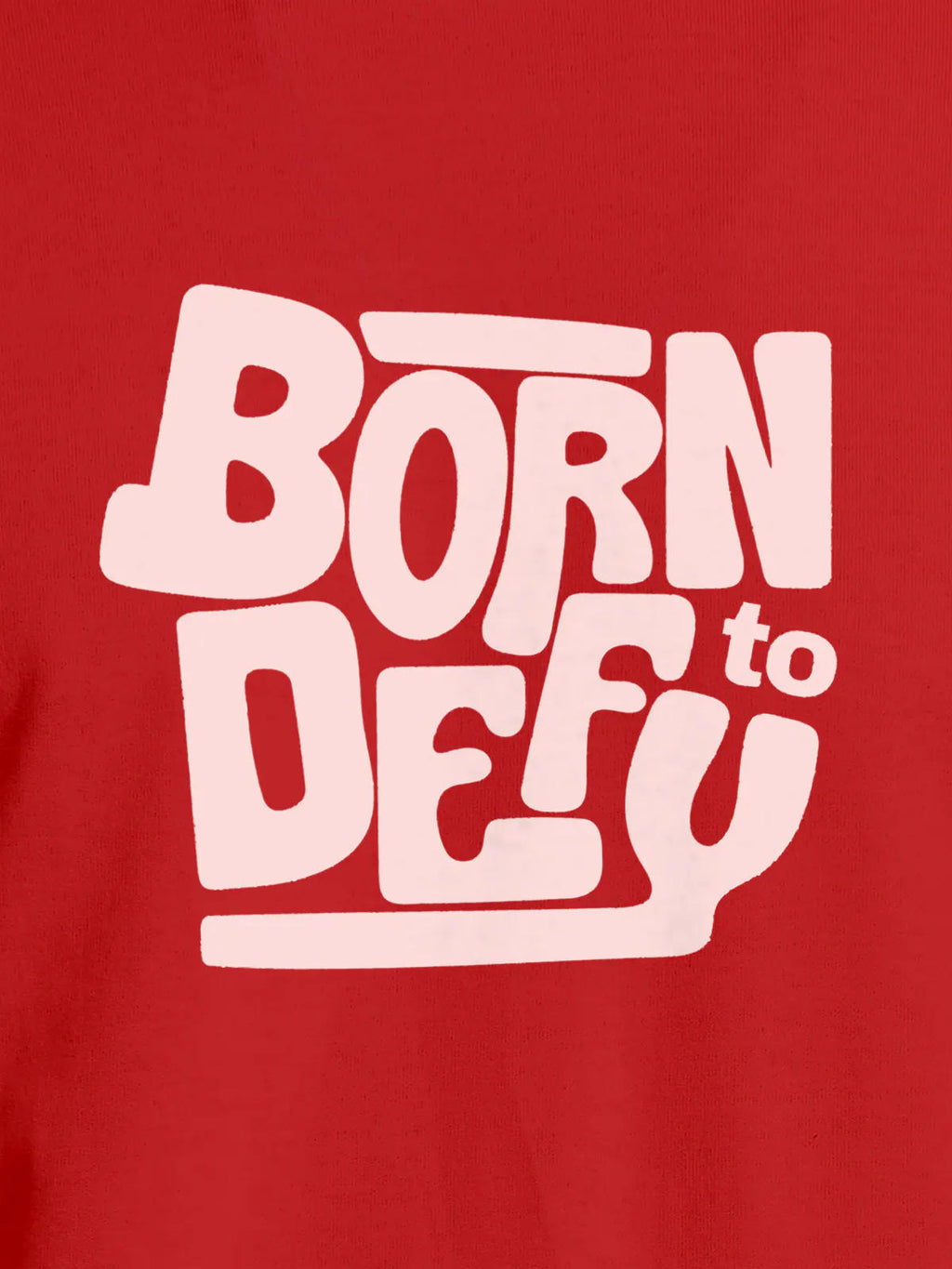 Close up of 'Born To Defy' design on Men's Red Round Neck T-shirt, highlighting intricate details and vibrant print.