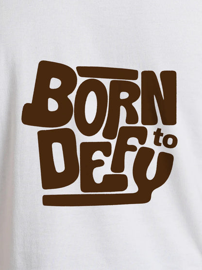 Close up of 'Born To Defy' design on Women's White Round Neck T-shirt, highlighting intricate details and vibrant print.