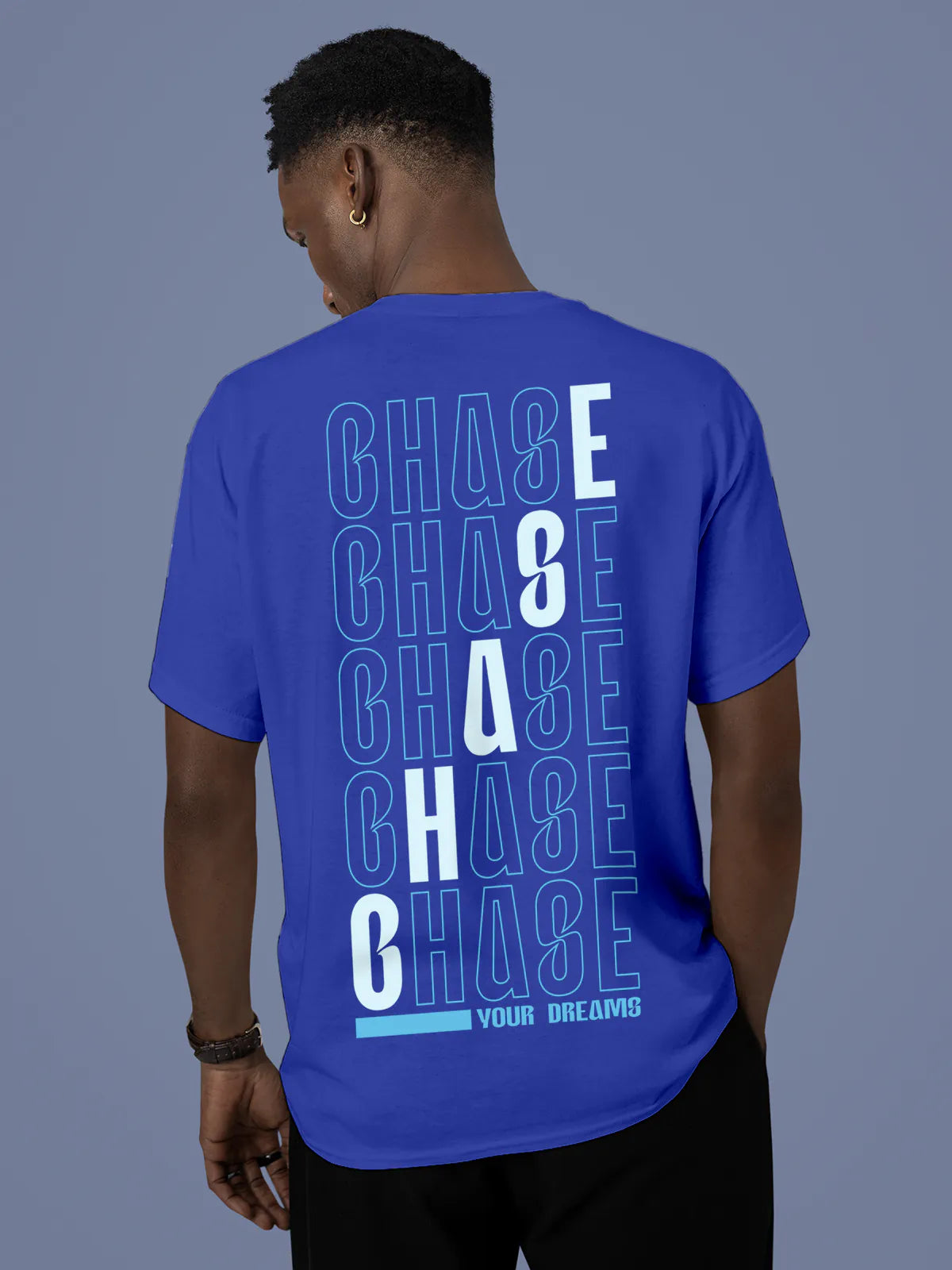 Model wearing Men's Blue Round Neck T-shirt with 'Chase Your Dreams' design, offering effortless style and premium comfort