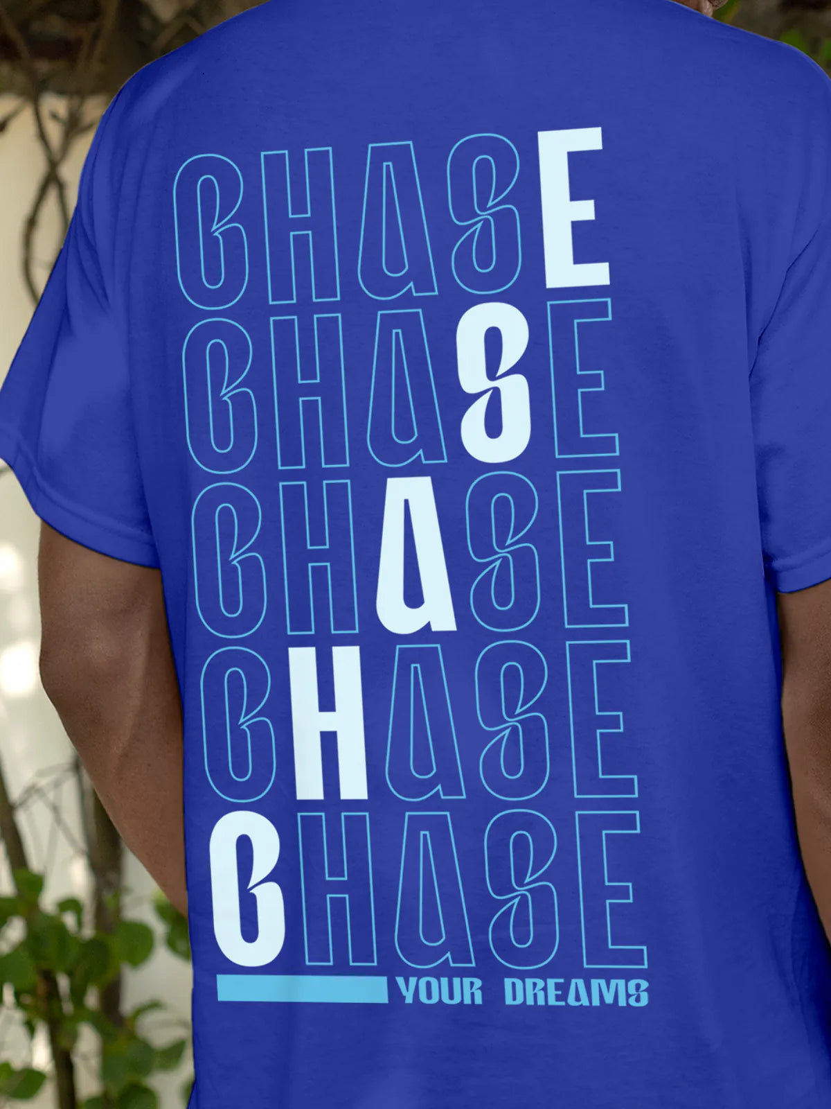 Close up of 'Chase Your Dreams' design on Men's Blue Round Neck T-shirt, highlighting intricate details and vibrant print.