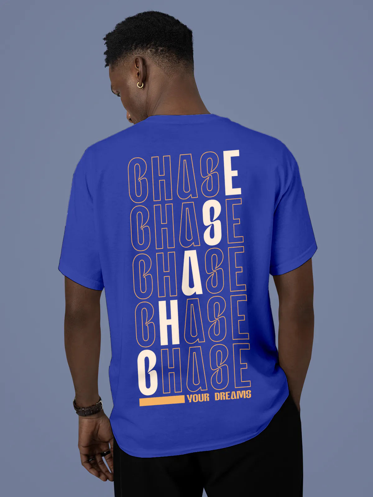 Model wearing Men's Blue Round Neck T-shirt with 'Chase Your Dreams' design, offering effortless style and premium comfort