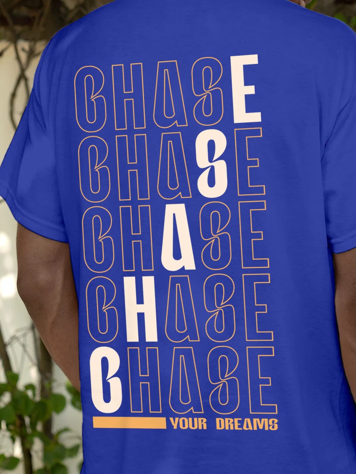 Close up of 'Chase Your Dreams' design on Men's Blue Round Neck T-shirt, highlighting intricate details and vibrant print.