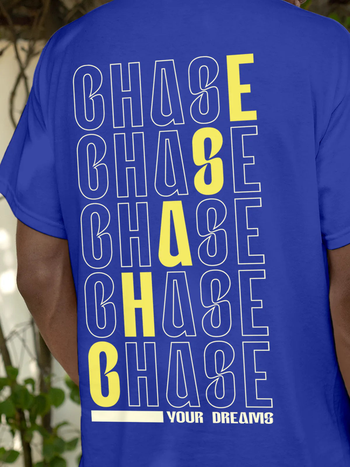 Close up of 'Chase Your Dreams' design on Men's Blue Round Neck T-shirt, highlighting intricate details and vibrant print.