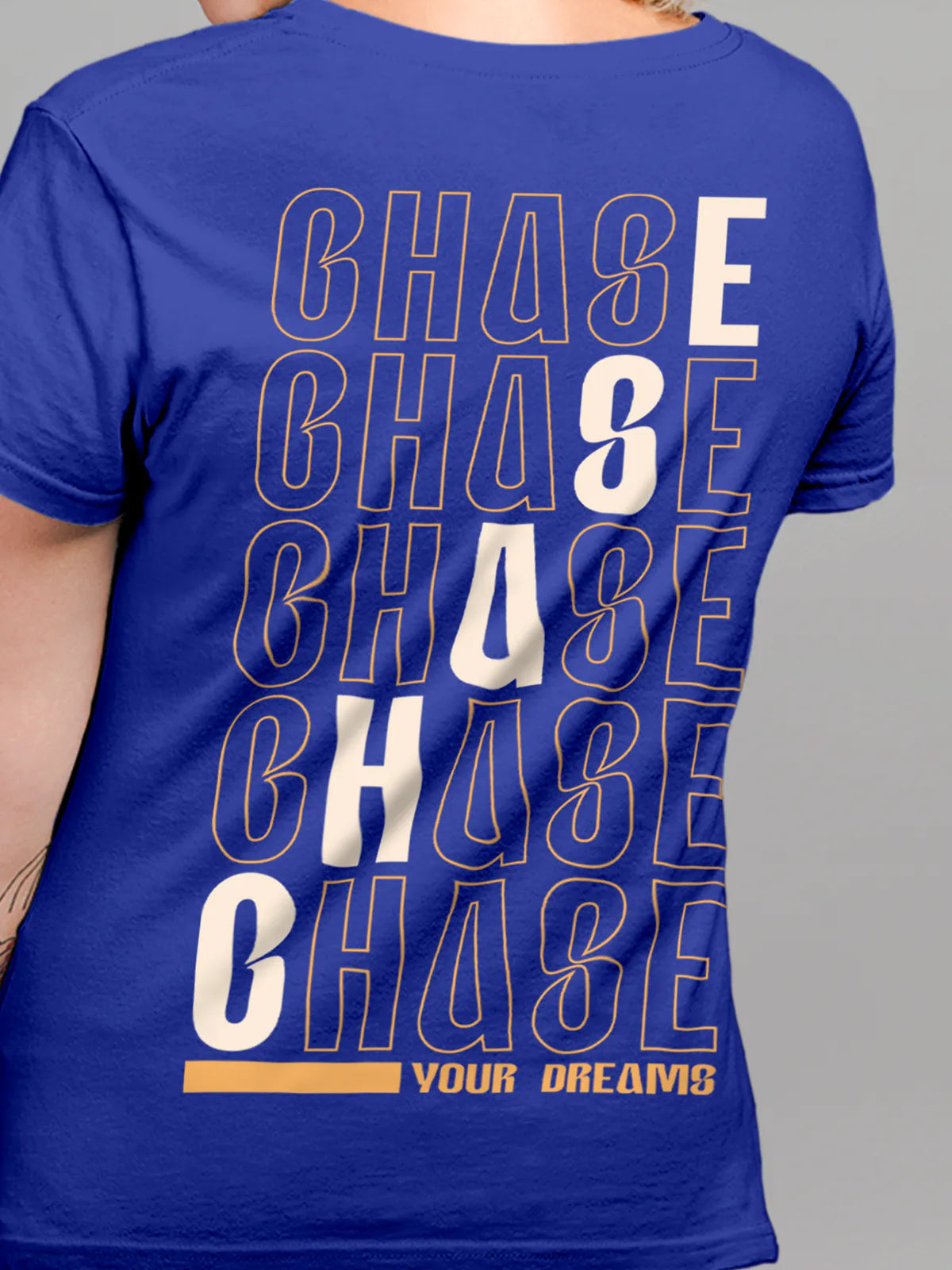 Close up of 'Chase Your Dreams' design on Women's Blue Round Neck T-shirt, highlighting intricate details and vibrant print.