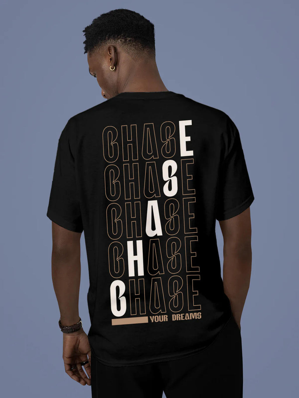 Model wearing Men's Black Round Neck T-shirt with 'Chase Your Dreams' design, offering effortless style and premium comfort