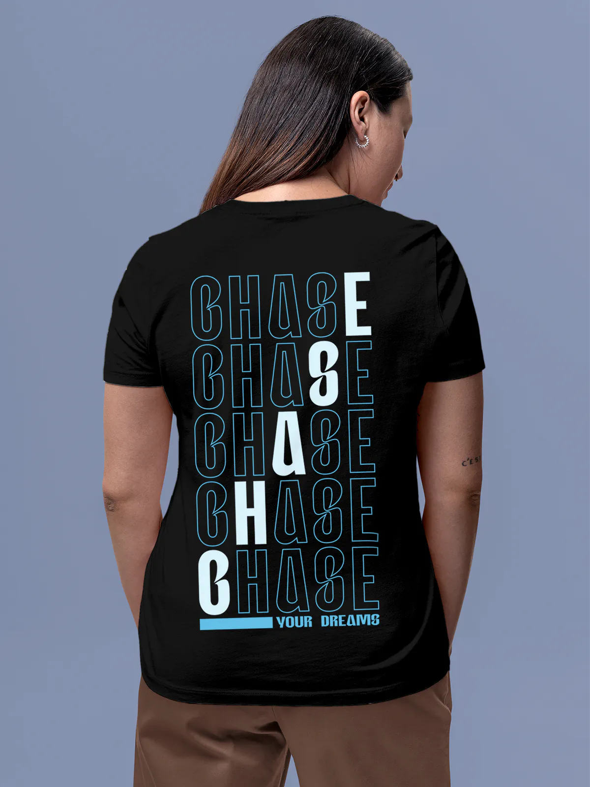 Model wearing Women's Black Round Neck T-shirt with 'Chase Your Dreams' design, offering effortless style and premium comfort