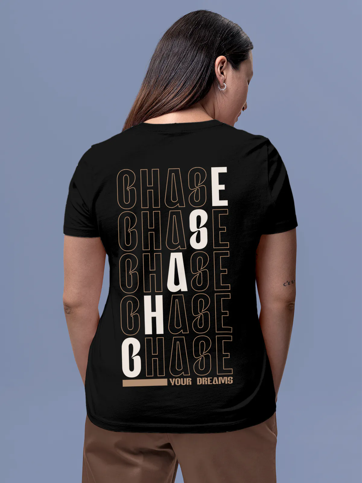 Model wearing Women's Black Round Neck T-shirt with 'Chase Your Dreams' design, offering effortless style and premium comfort
