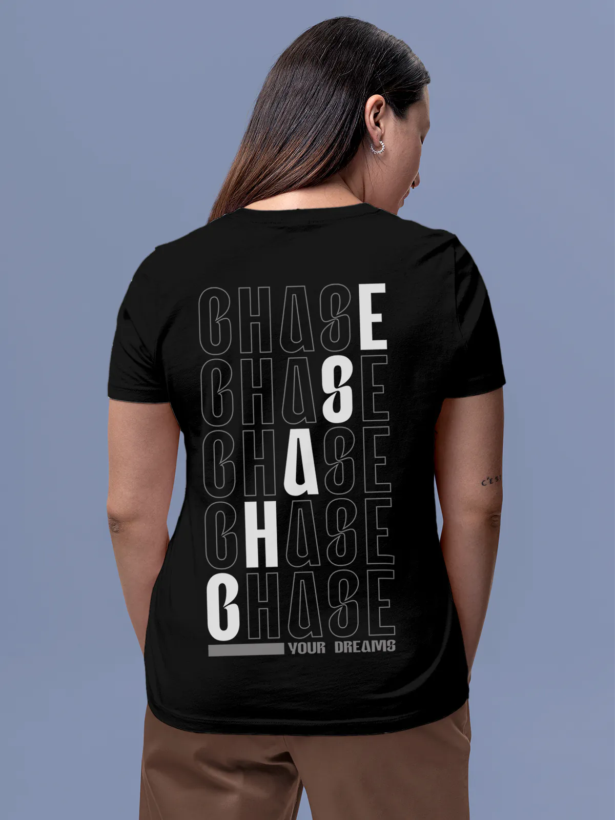 Model wearing Women's Black Round Neck T-shirt with 'Chase Your Dreams' design, offering effortless style and premium comfort